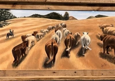Home Page 4 Cattle being herded across golden fields.